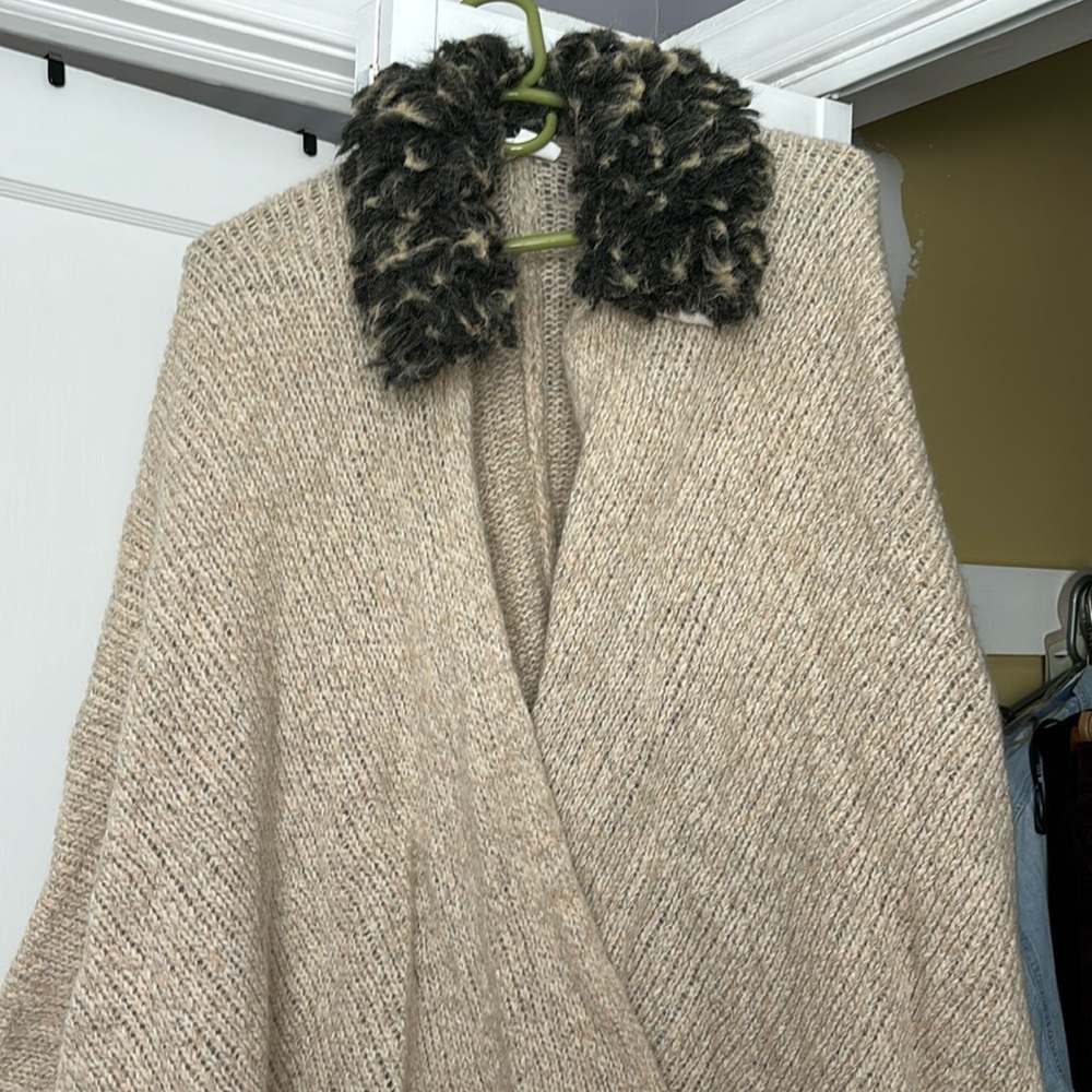 Italian import 100%wool, cape with matching hat. Faux fur collar.